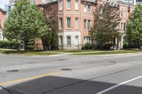 a street with buildings and a blue fire hydrant on it's curb and sidewalk