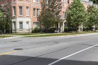 a street with buildings and a blue fire hydrant on it's curb and sidewalk