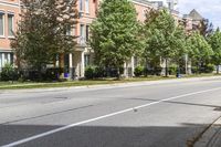 a street with buildings and a blue fire hydrant on it's curb and sidewalk