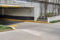 two people in a parking garage attached to an awning and a bicycle on a sidewalk