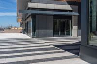 a building with windows has a sign above it stating a business on its front floor