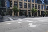 a motorcycle is riding down the road next to a city street and many buildings on both sides