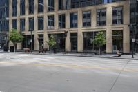 a motorcycle is riding down the road next to a city street and many buildings on both sides