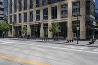 a motorcycle is riding down the road next to a city street and many buildings on both sides