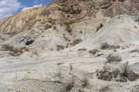 a person riding their horse through the desert terrain at a scenic area in the mountains