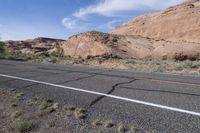 Road on Low Desert Landscape with Asphalt