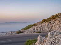 Road at Dawn: Break of Day by the Ocean with Clouds