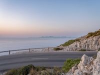 Road at Dawn: Break of Day by the Ocean with Clouds