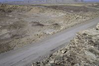 an image of a road through a valley in the desert with an open space for vehicles