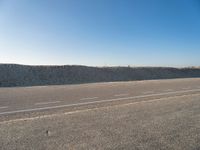 Road through Holland's Coastal Landscape with Clear Sky