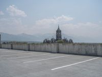 a parking lot and wall are pictured in a photo from the perspective point of view