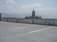 a parking lot and wall are pictured in a photo from the perspective point of view