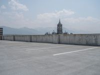 a parking lot and wall are pictured in a photo from the perspective point of view