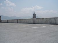 a parking lot and wall are pictured in a photo from the perspective point of view