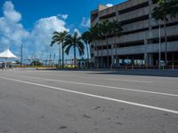 an empty lot with an empty parking lot in the background and clouds in the distance