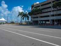 an empty lot with an empty parking lot in the background and clouds in the distance