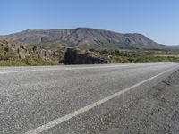 Road Through Iceland: Majestic Mountains and Vast Plains