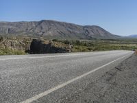 Road Through Iceland: Majestic Mountains and Vast Plains