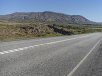 Road Through Iceland: Majestic Mountains and Vast Plains