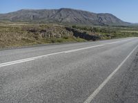 Road Through Iceland: Majestic Mountains and Vast Plains