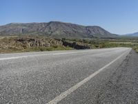 Road Through Iceland: Majestic Mountains and Vast Plains