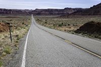 Road Through Utah Desert: A Scenic Mountain Landscape