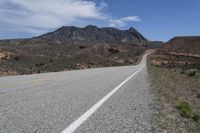 a bike is shown on a highway near the desert mountains of texas, usa by an unknown road