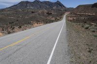 a bike is shown on a highway near the desert mountains of texas, usa by an unknown road