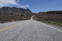 a bike is shown on a highway near the desert mountains of texas, usa by an unknown road