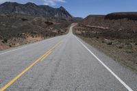 a bike is shown on a highway near the desert mountains of texas, usa by an unknown road