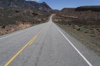 a bike is shown on a highway near the desert mountains of texas, usa by an unknown road