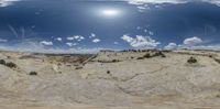 the view from an open car traveling down a hill side road in a panorama lens