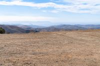 the hills in the distance are rocky and empty, and there is no one on the far side