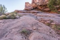 a person walking up and down a rock face side by side on a rocky trail