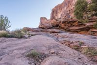 a person walking up and down a rock face side by side on a rocky trail