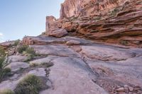 a person walking up and down a rock face side by side on a rocky trail