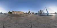 a 360 - fish eye view of the city of rotterdam and the river at the end of the road