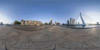 a 360 - fish eye view of the city of rotterdam and the river at the end of the road