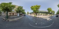 a street that looks like the street is round as it appears in this 360 - view image