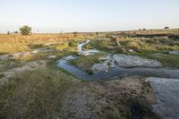 Rugged African Landscape with Road and Water Resources