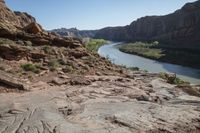 large area with a river, mountain and trees on it, in the middle of a dry landscape