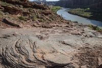 large area with a river, mountain and trees on it, in the middle of a dry landscape