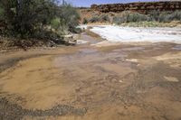 Rugged Coastal Region: Red Rock Formations and Clear Skies