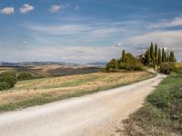 Rugged Dirt Road in Tuscany under a Clear Sky