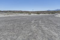 a red truck is driving through the rocky landscape of the desert of an arid area