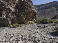 a rocky outcropping in the middle of nowhere with a clear sky above