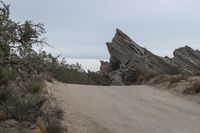 there is an unusual formation in the landscape of rocky pinnacles as well as trees