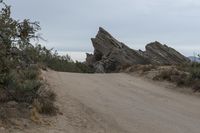 there is an unusual formation in the landscape of rocky pinnacles as well as trees