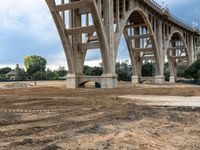 a view of the construction of a large bridge from below with no one inside the structure