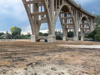 a view of the construction of a large bridge from below with no one inside the structure